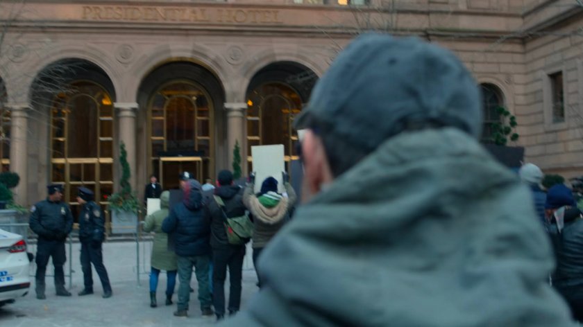 Matt in the courtyard of the Presidential Hotel amidst protestors.