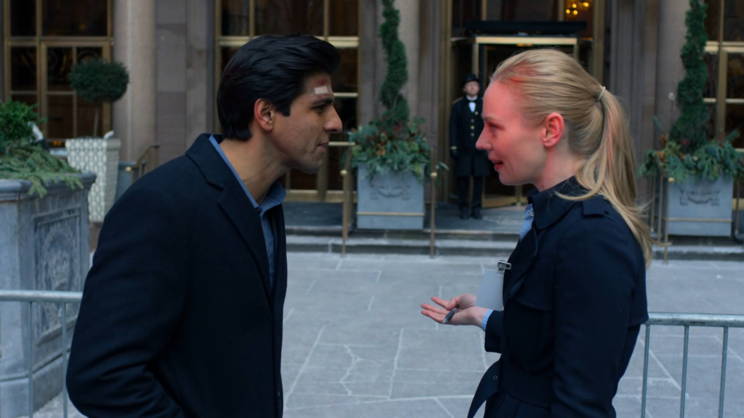 Karen speaking to Nadeem in front of the Presidential Hotel.