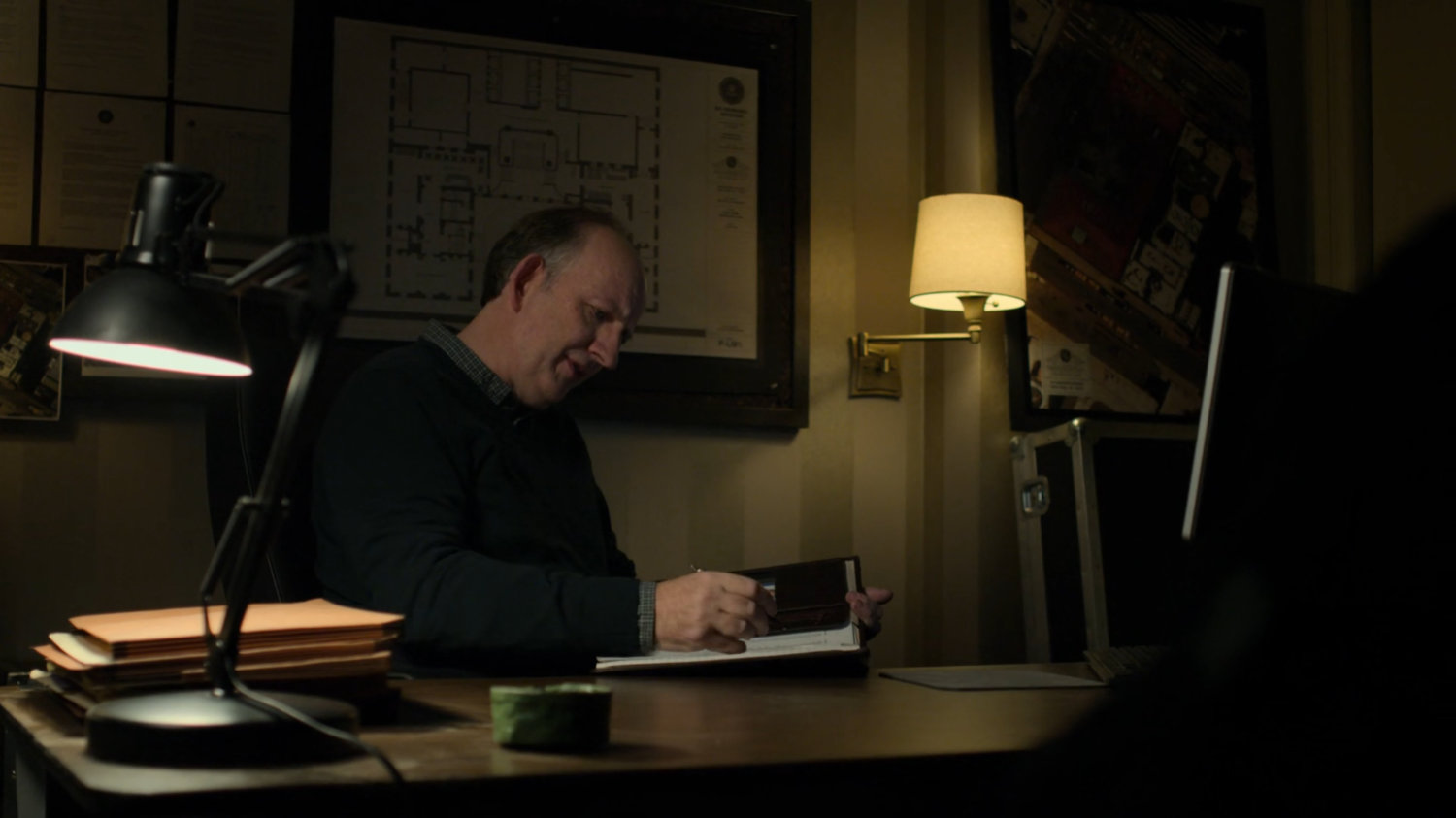 Dex's doctor takes notes during an interview.