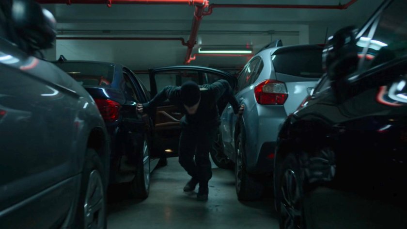 The Man in Black sneaking through the Hotel parking garage.