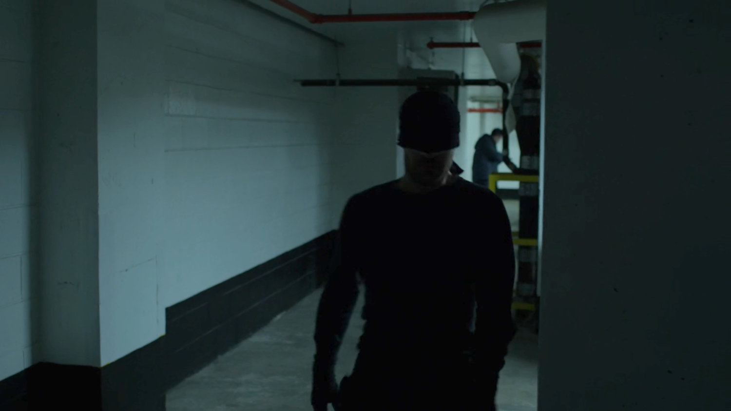 The Man in Black sneaking through the Hotel parking garage.