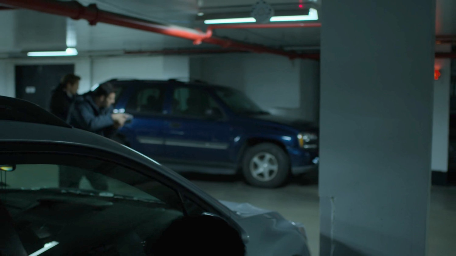 FBI agents in the Hotel parking garage.