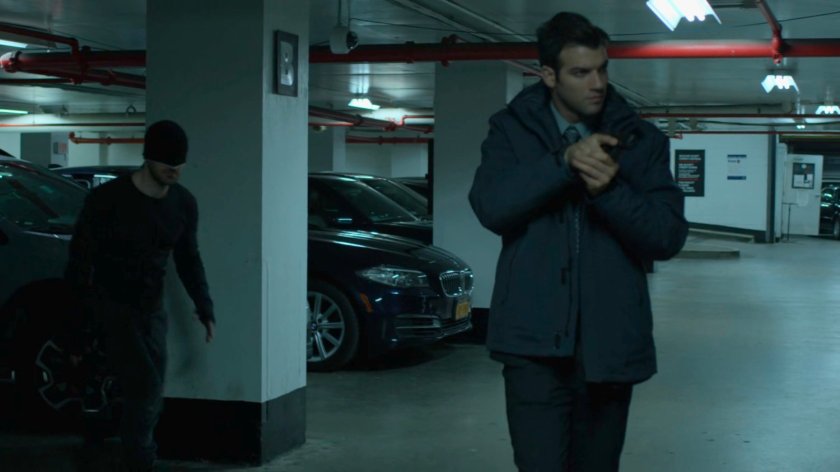 The Man in Black sneaks up on an FBI agent in the Hotel parking garage.