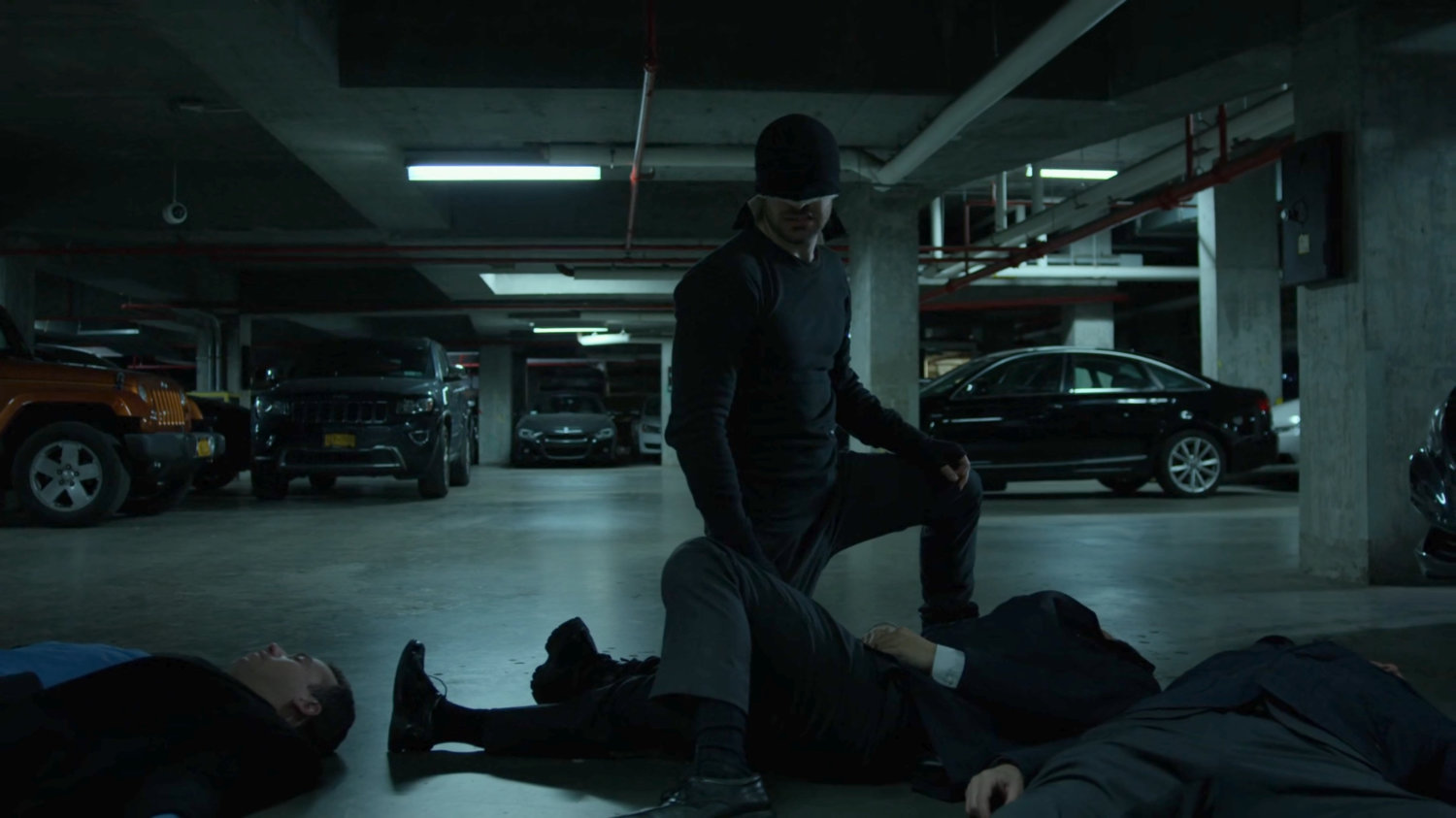 The Man in Black kneeling over FBI agents in the Hotel parking garage.