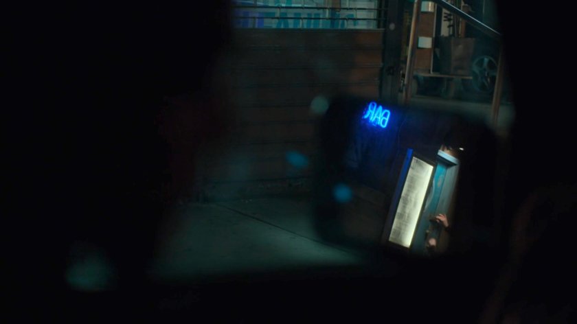 Dex spying on Julie leaving a bar.