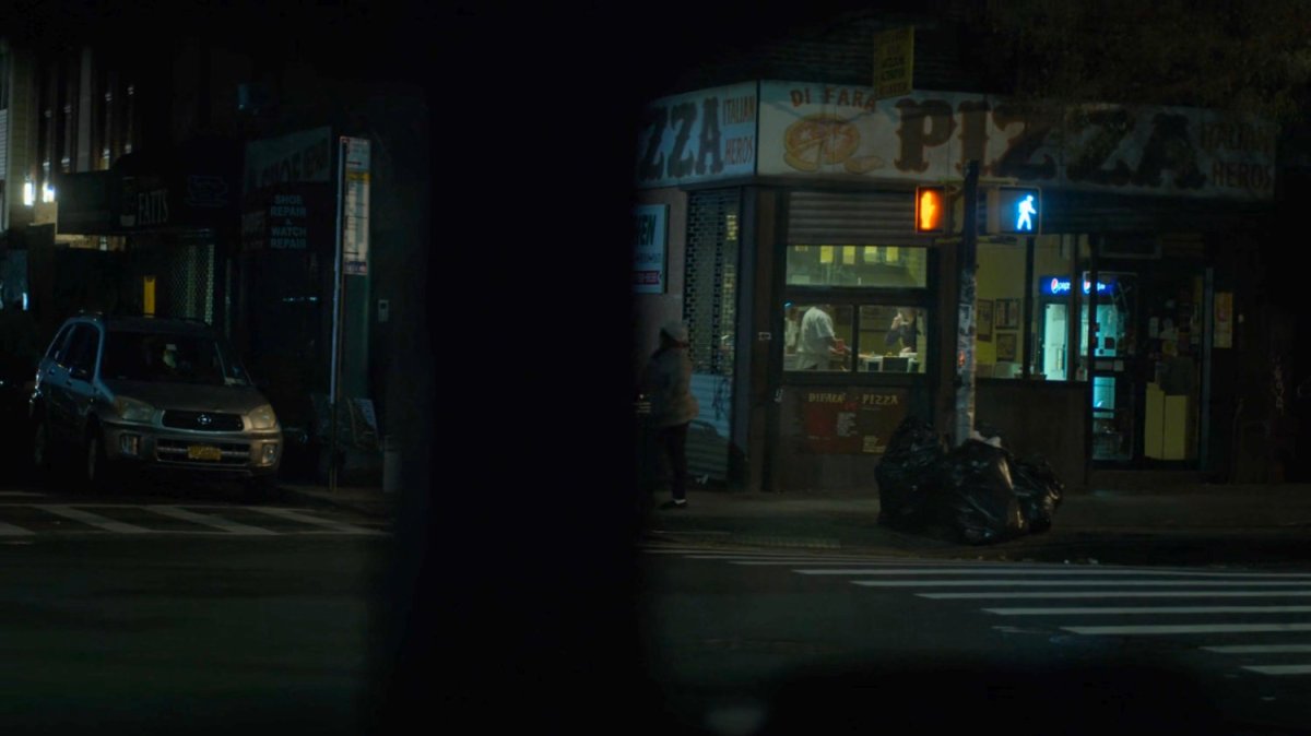 Dex spying on Julie in a pizza parlor.