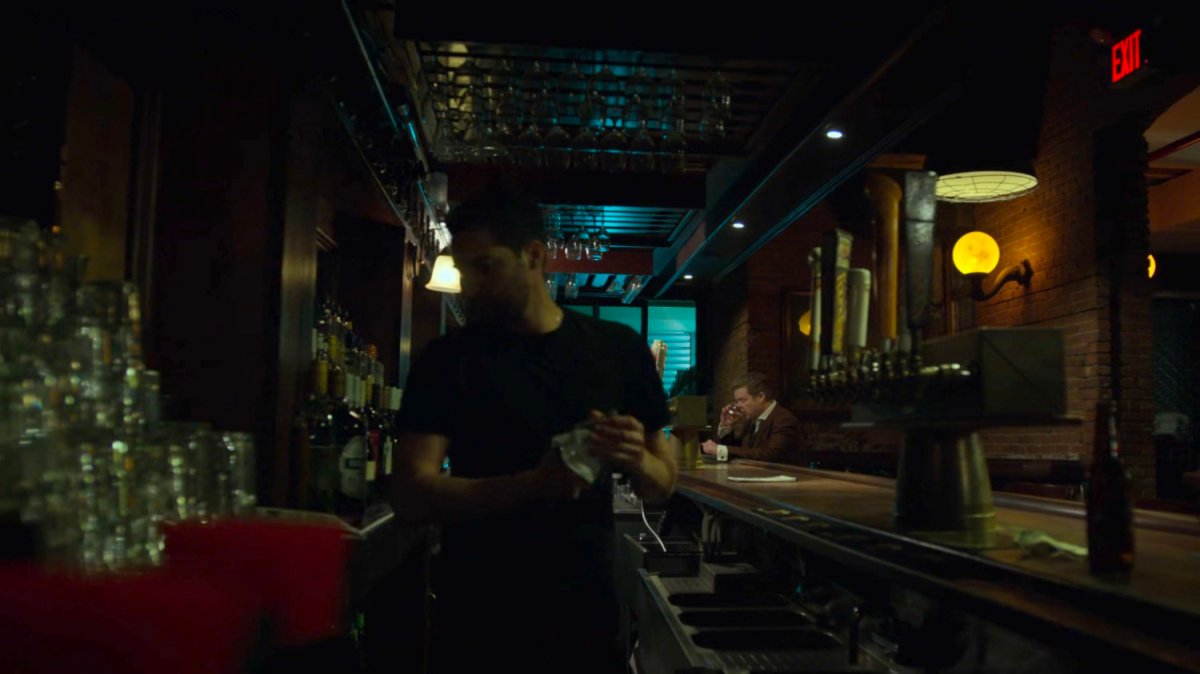 Foggy drinking alone in a bar.