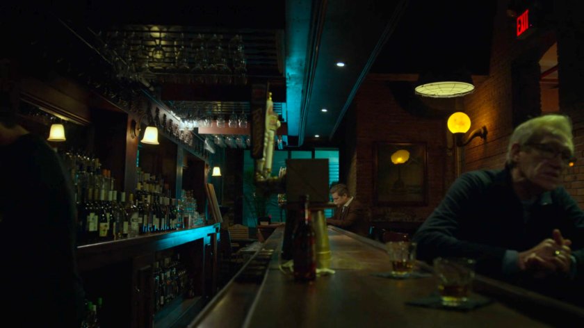 Foggy drinking alone in a bar.