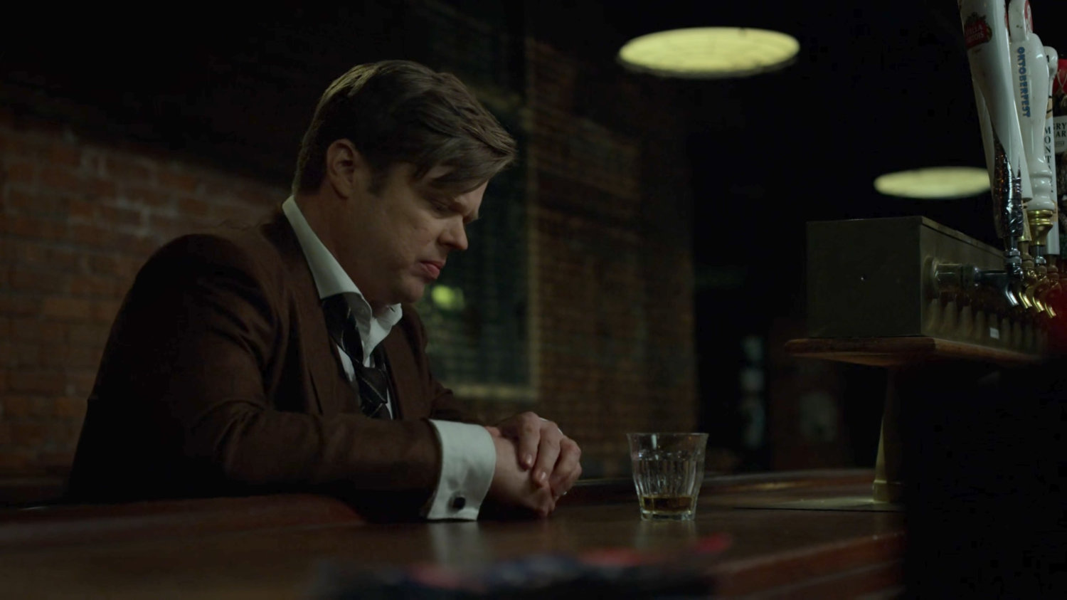 Foggy drinking alone in a bar.
