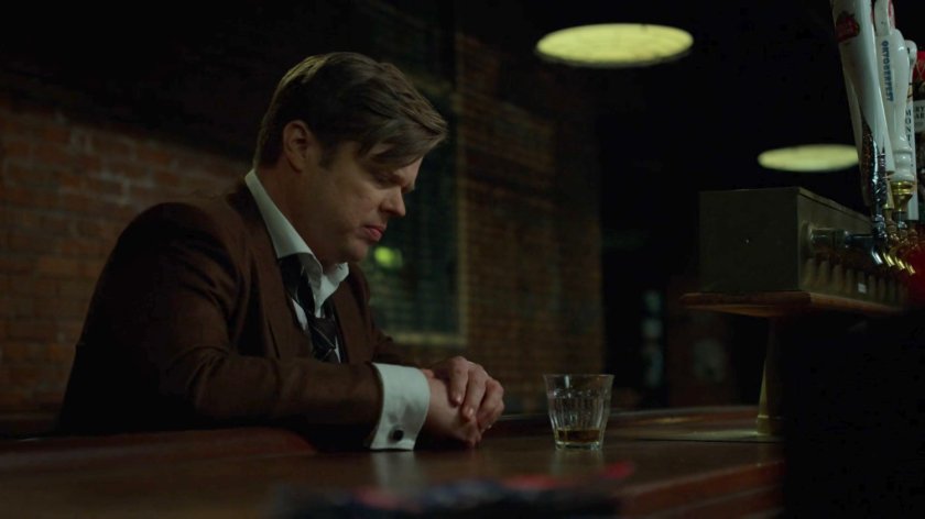 Foggy drinking alone in a bar.