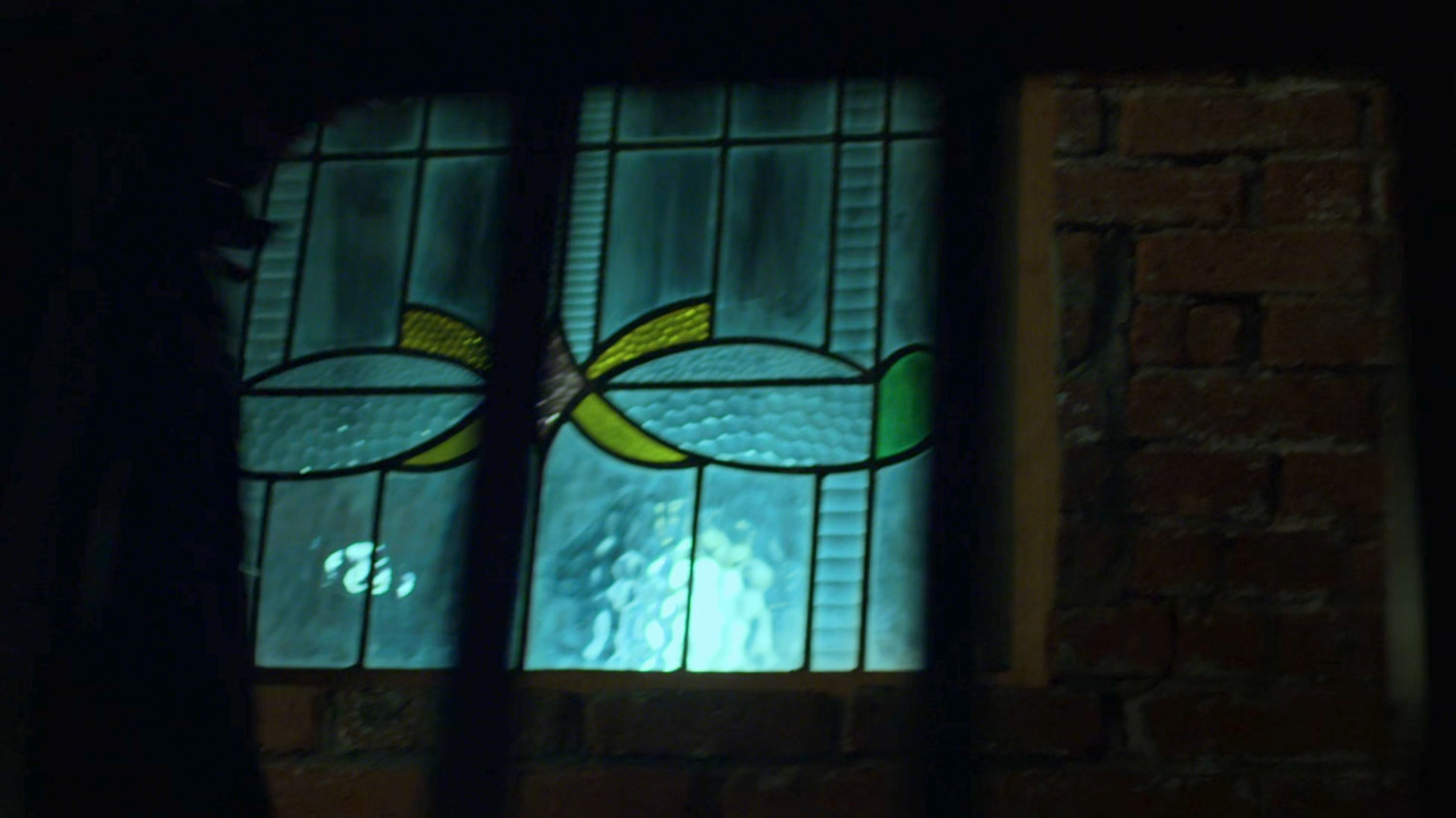 Stained glass window outside the bar.