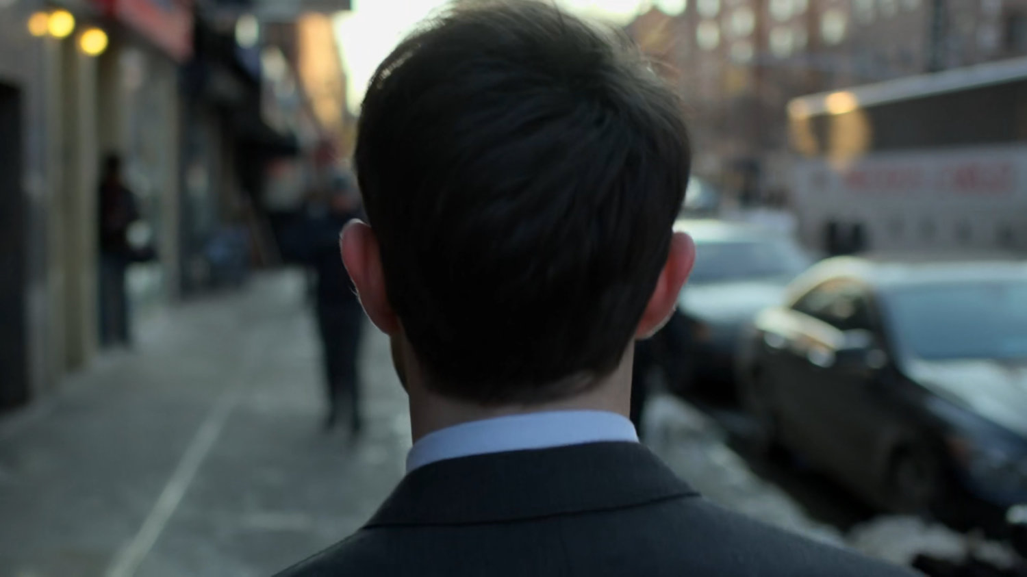 Matt walking along a sidewalk.