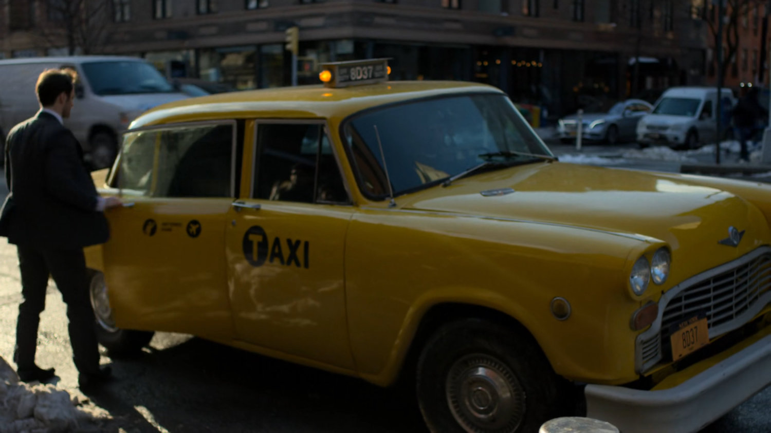 Matt getting into taxi.