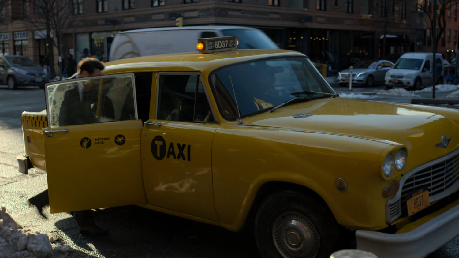 Matt getting into taxi.