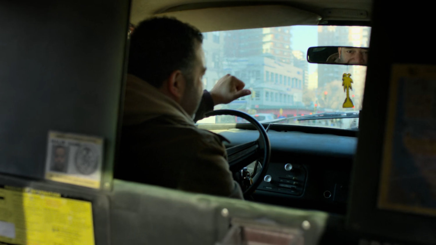 Taxi driver asking Matt where he wants to go.