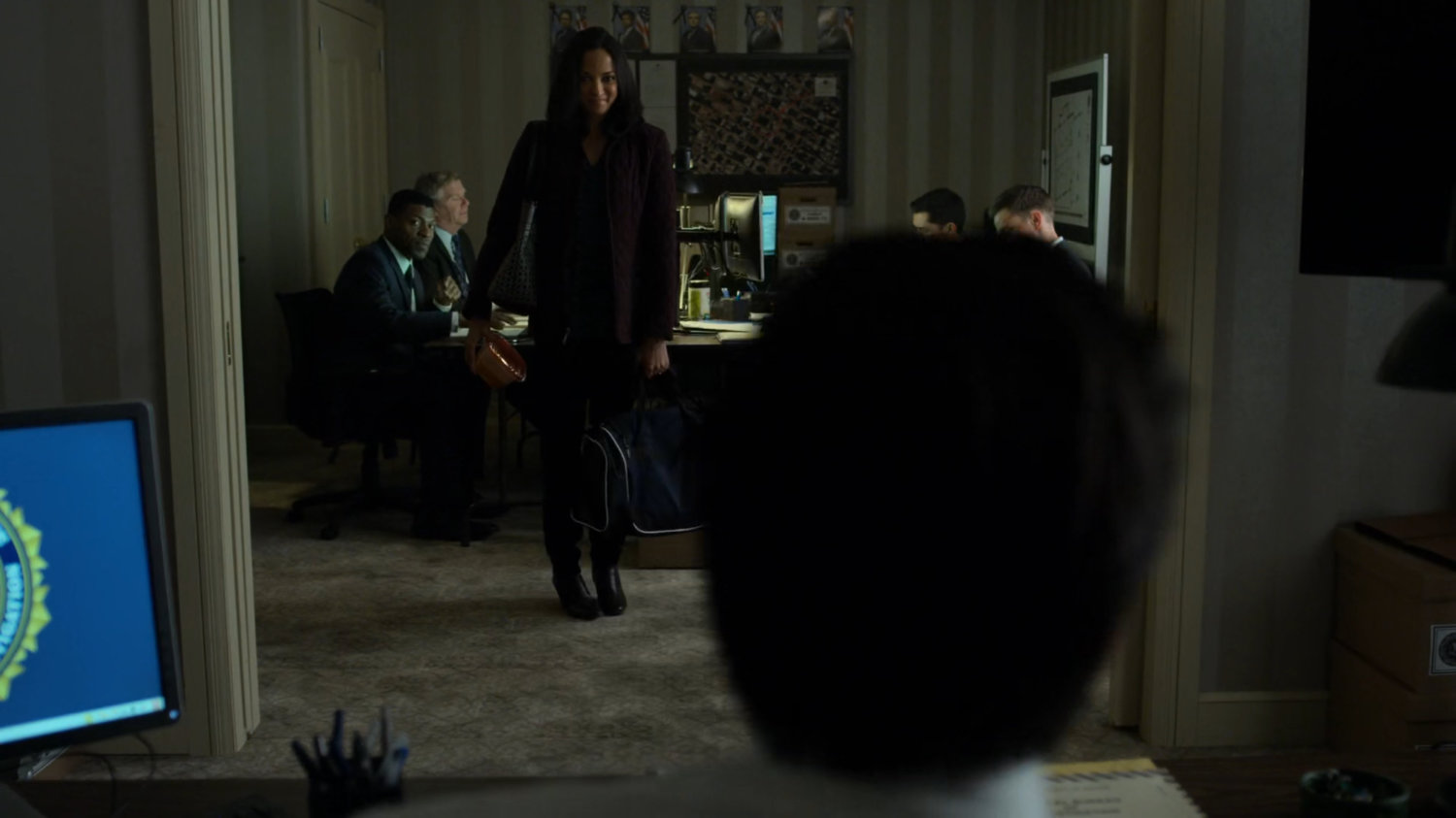 Agent Nadeem sees his wife in the FBI Offices in the Presidential Hotel.