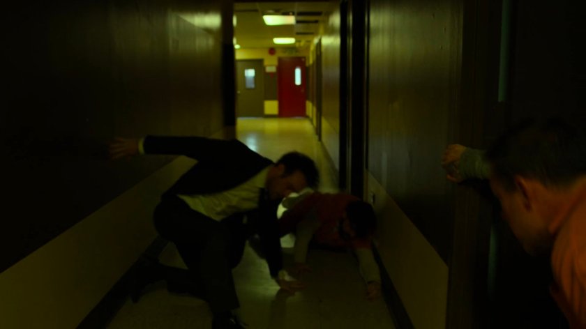 Matt fights prisoners in penitentiary hallway.