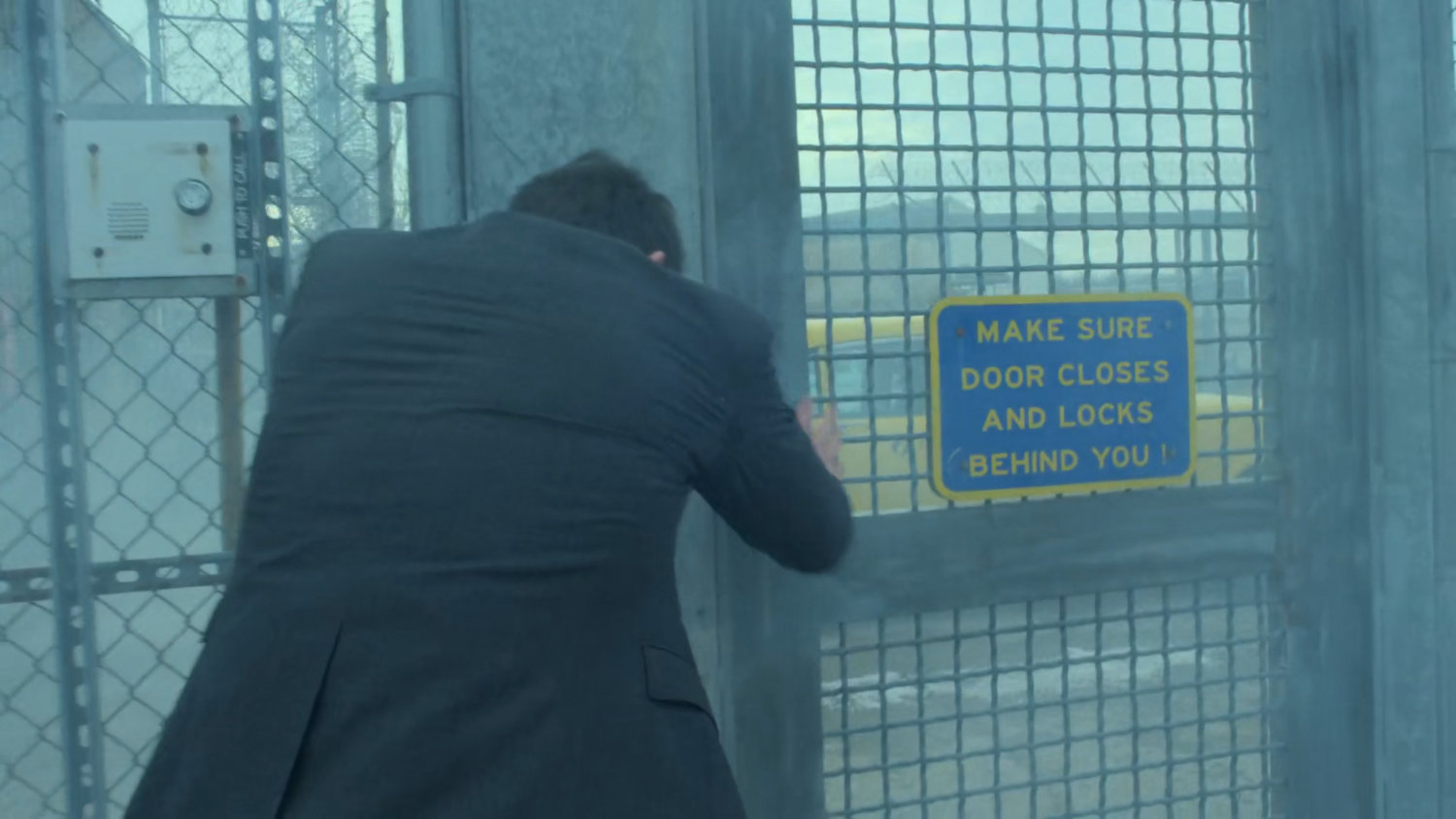 Matt exits through penitentiary gate.