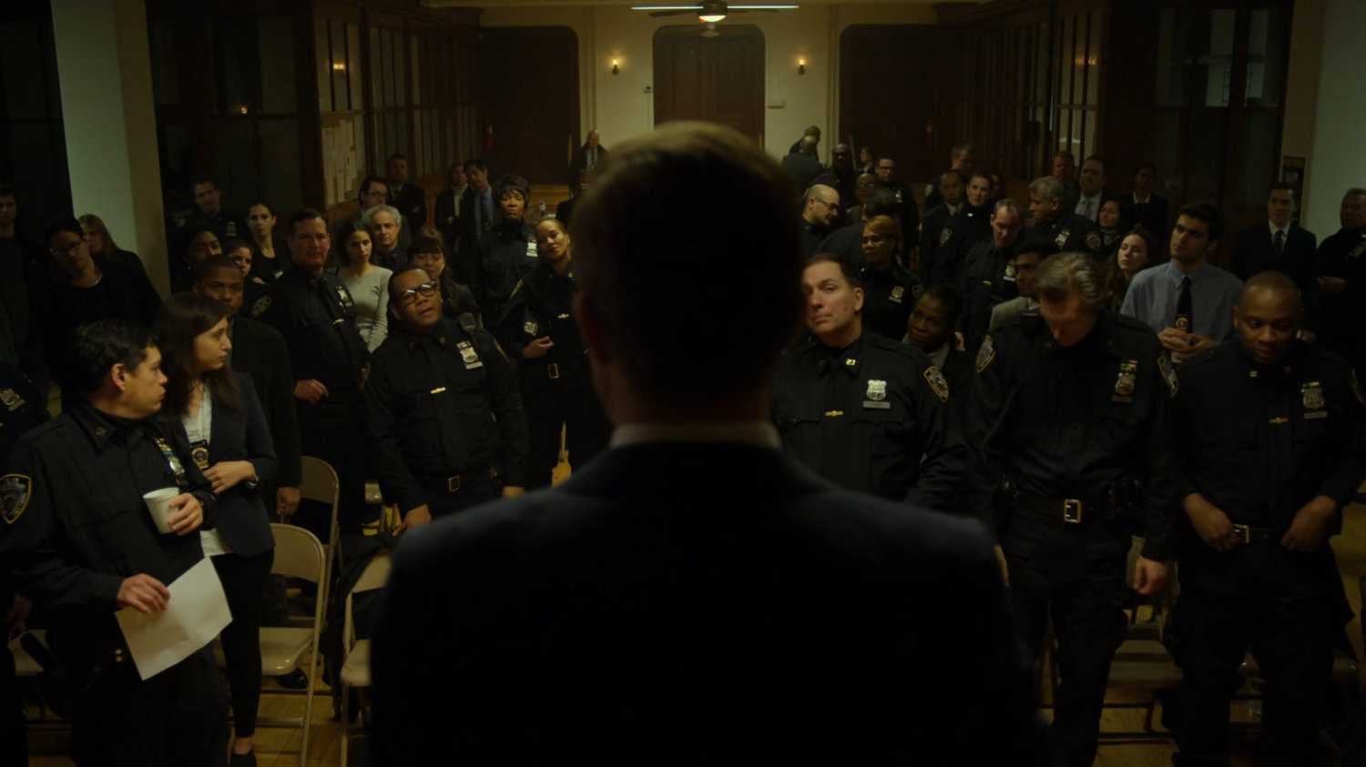 Foggy speaks to the officers at the police union meeting.