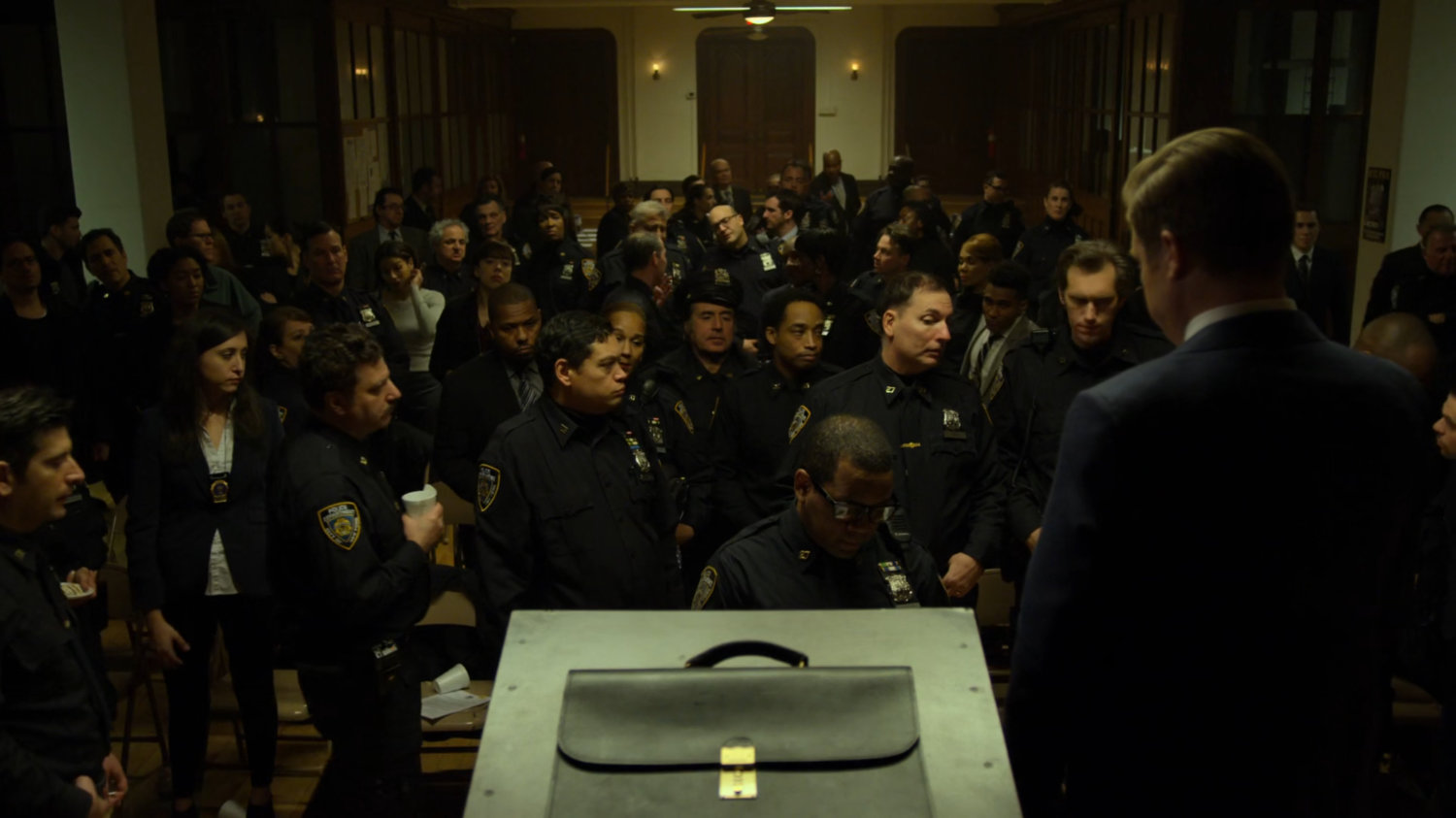 Foggy speaks to the officers at the police union meeting.