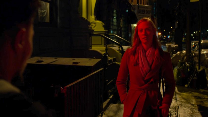 Karen confronts three youths on a dark sidewalk at night.