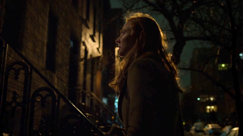 Karen outside Tanya Mills building at night.