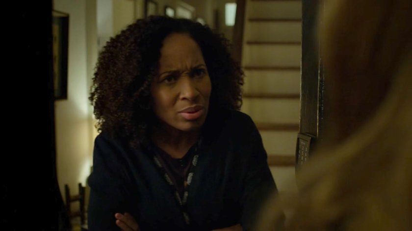 Tanya Mills talks to Karen in front of her home.