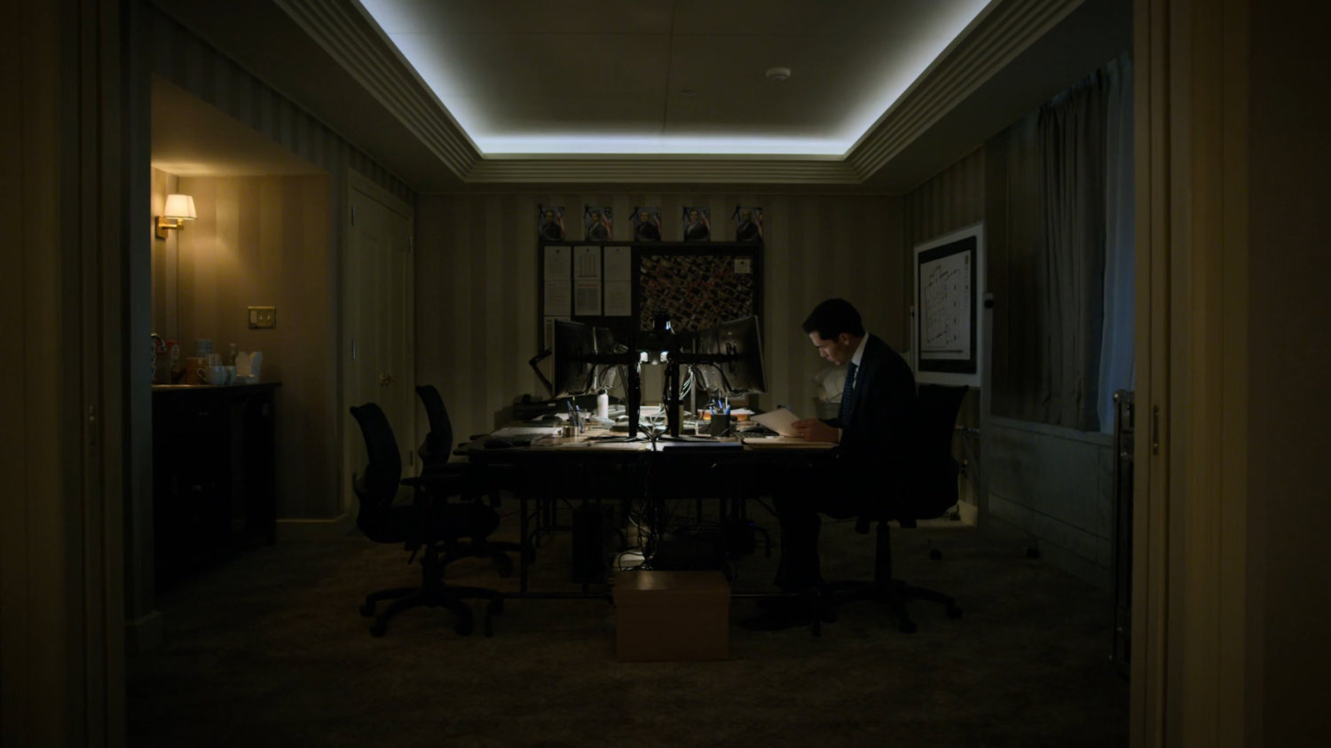 Agent Lim working late at the FBI Offices in the Presidential Hotel.