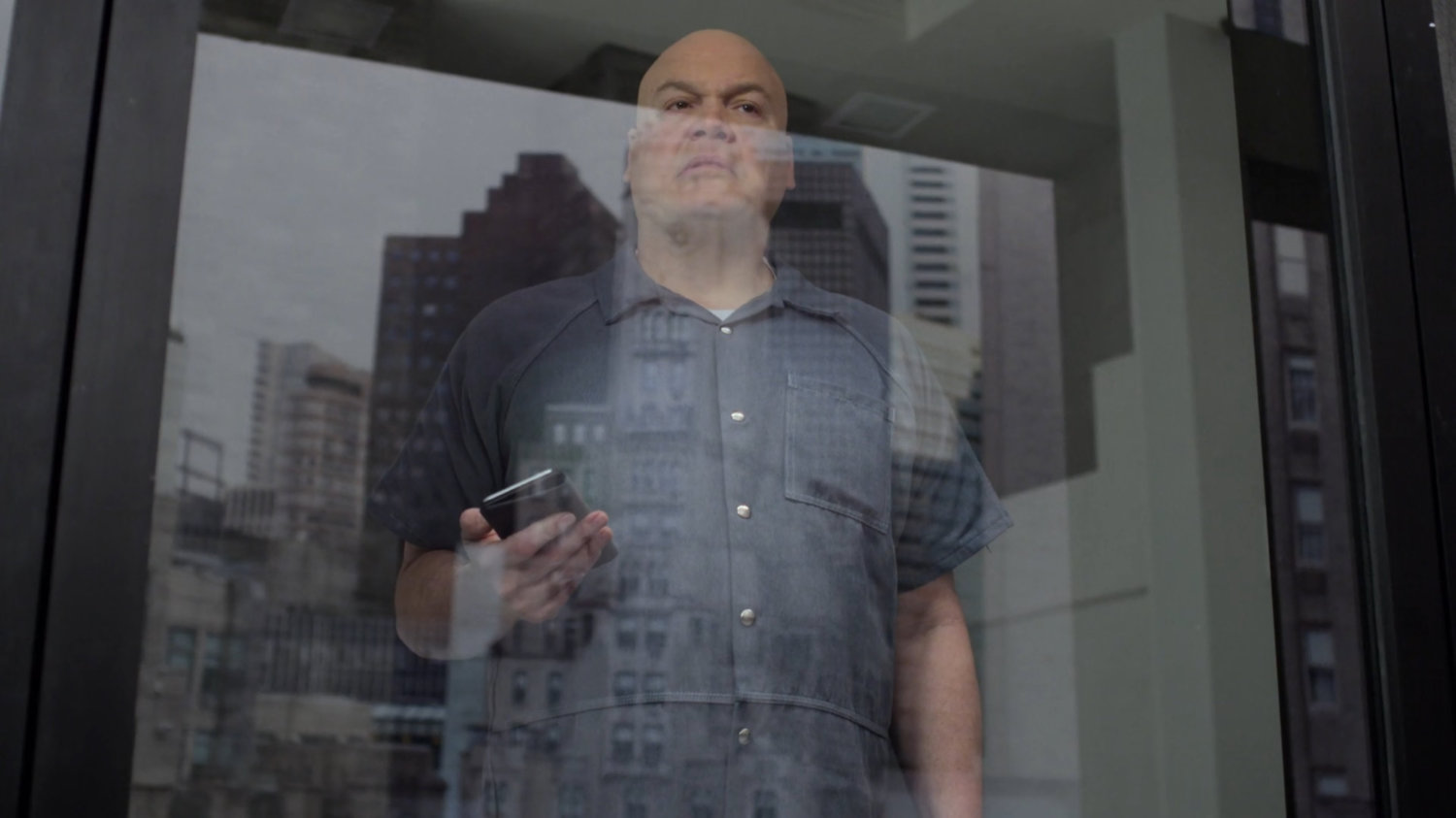 Fisk looking out the window of the penthouse of the Presidential Hotel.