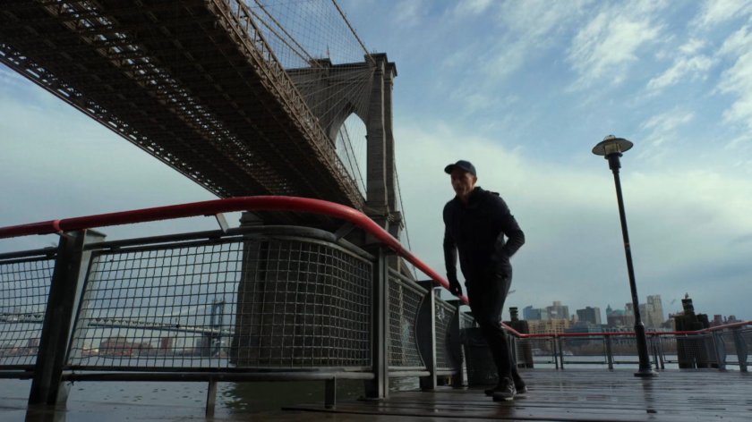 Dex on the jogging path under FDR drive, with the Brooklyn Bridge in the background.