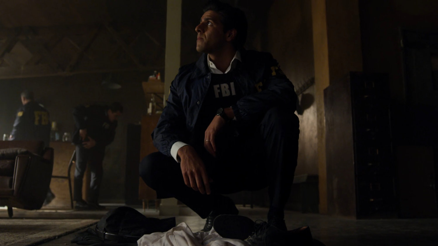 Agent Nadeem in Matt Murdock's apartment.