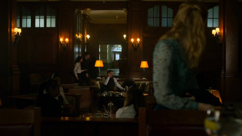 Karen leaving the bar in a social club.