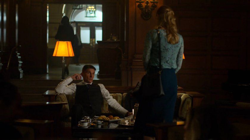 Karen talking to Felix Manning in a social club.