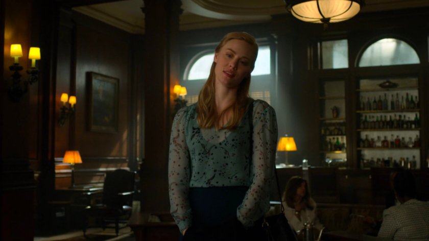 Karen talking to Felix Manning in a social club.