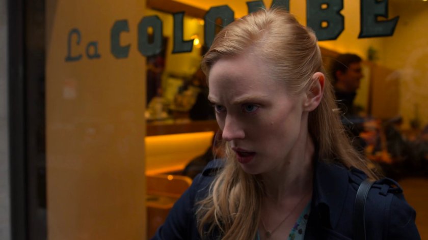 Karen glaring at FBI agents from a Wall Street sidewalk.