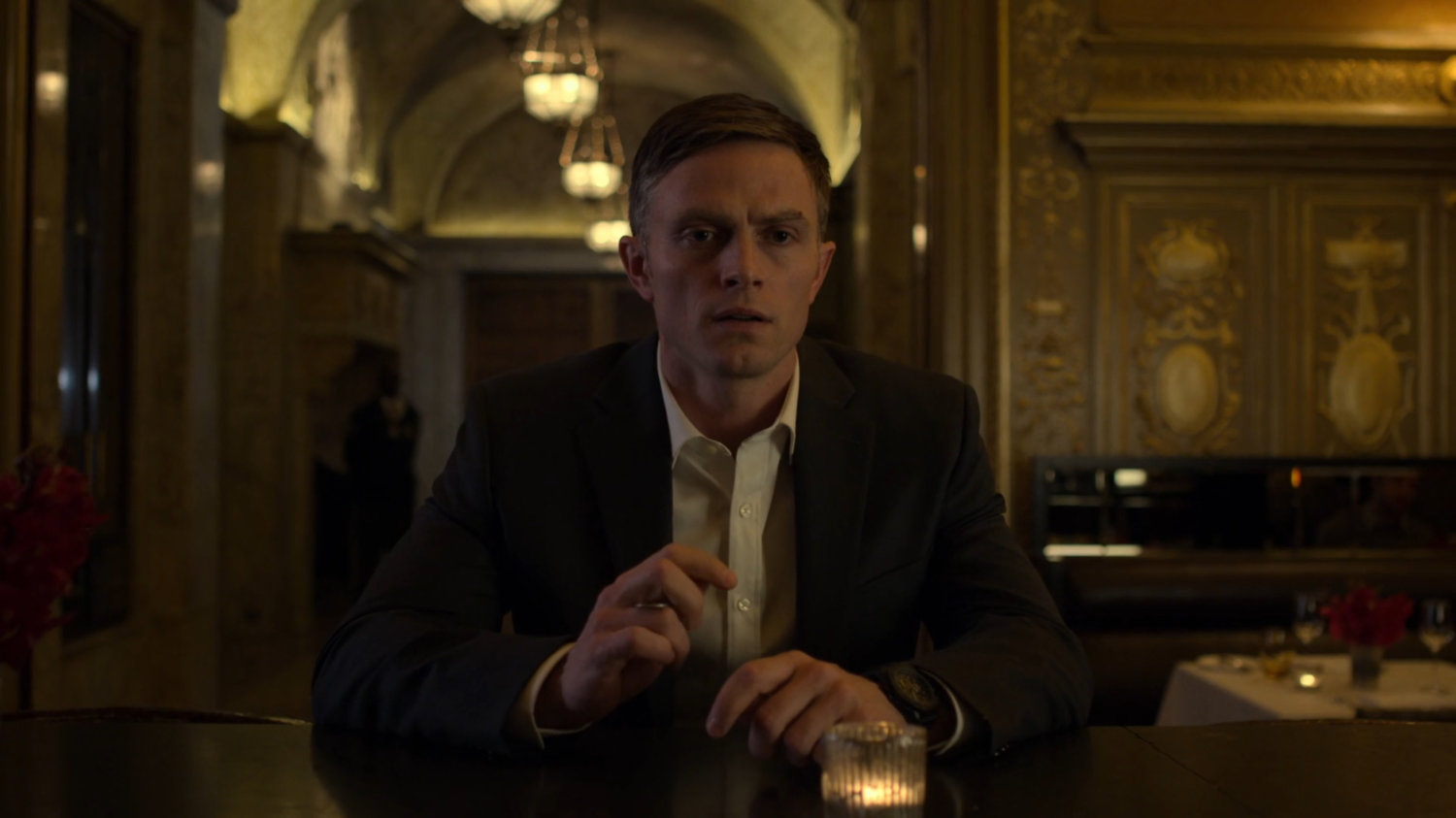 Dex sitting alone at the bar in the Presidential Hotel.