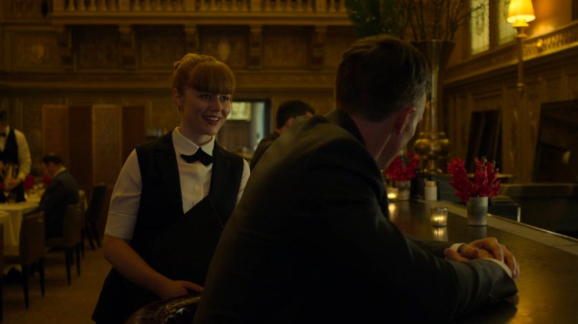 Dex talking to Julie at the bar in the Presidential Hotel.