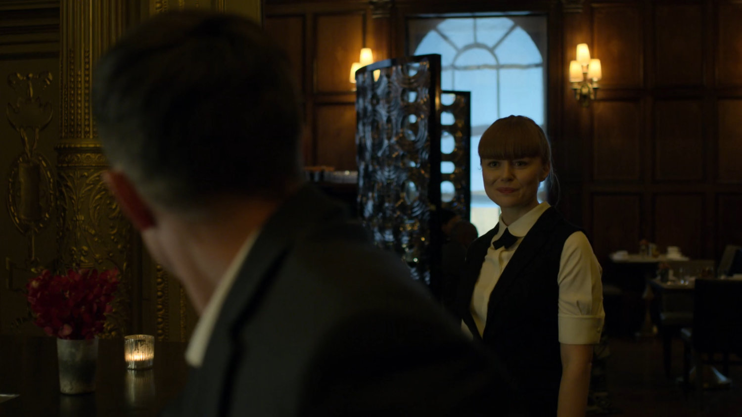 Dex talking to Julie at the bar in the Presidential Hotel.