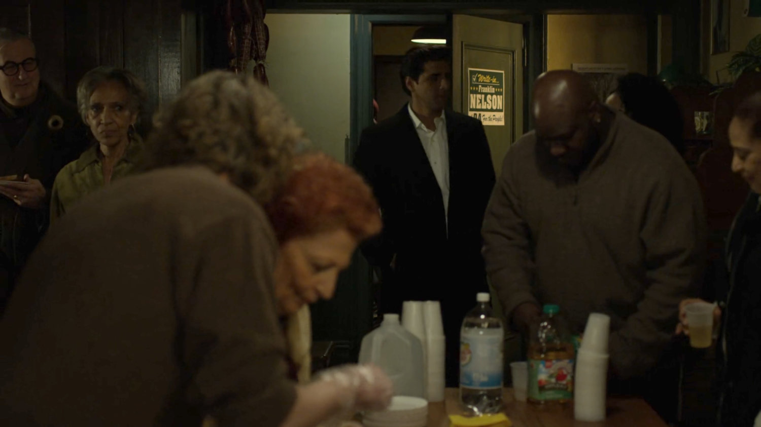 Agent Nadeem entering Nelson's Meats.