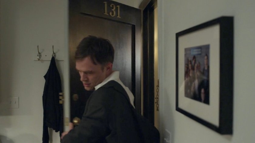 Dex entering his apartment.