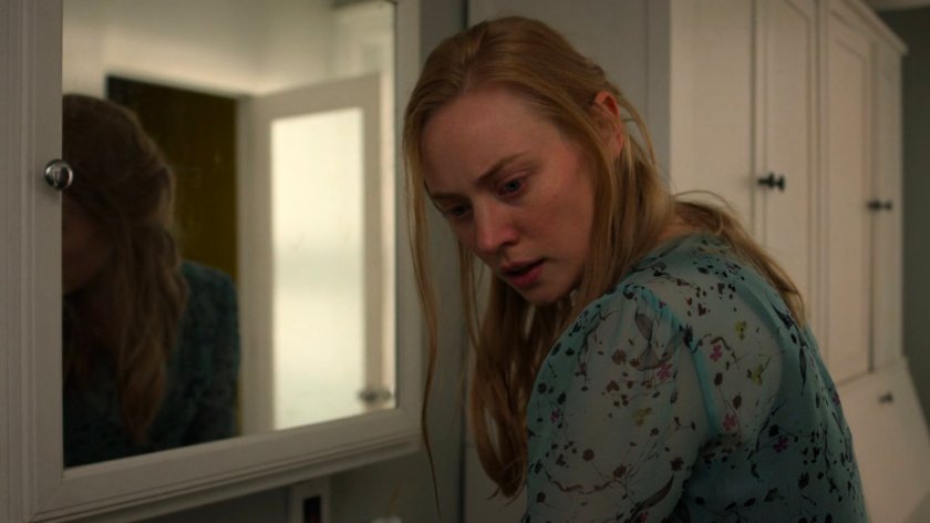 Karen at the sink in her apartment.