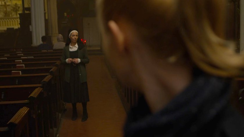 Karen speaking to Sister Maggie in Matt's church.