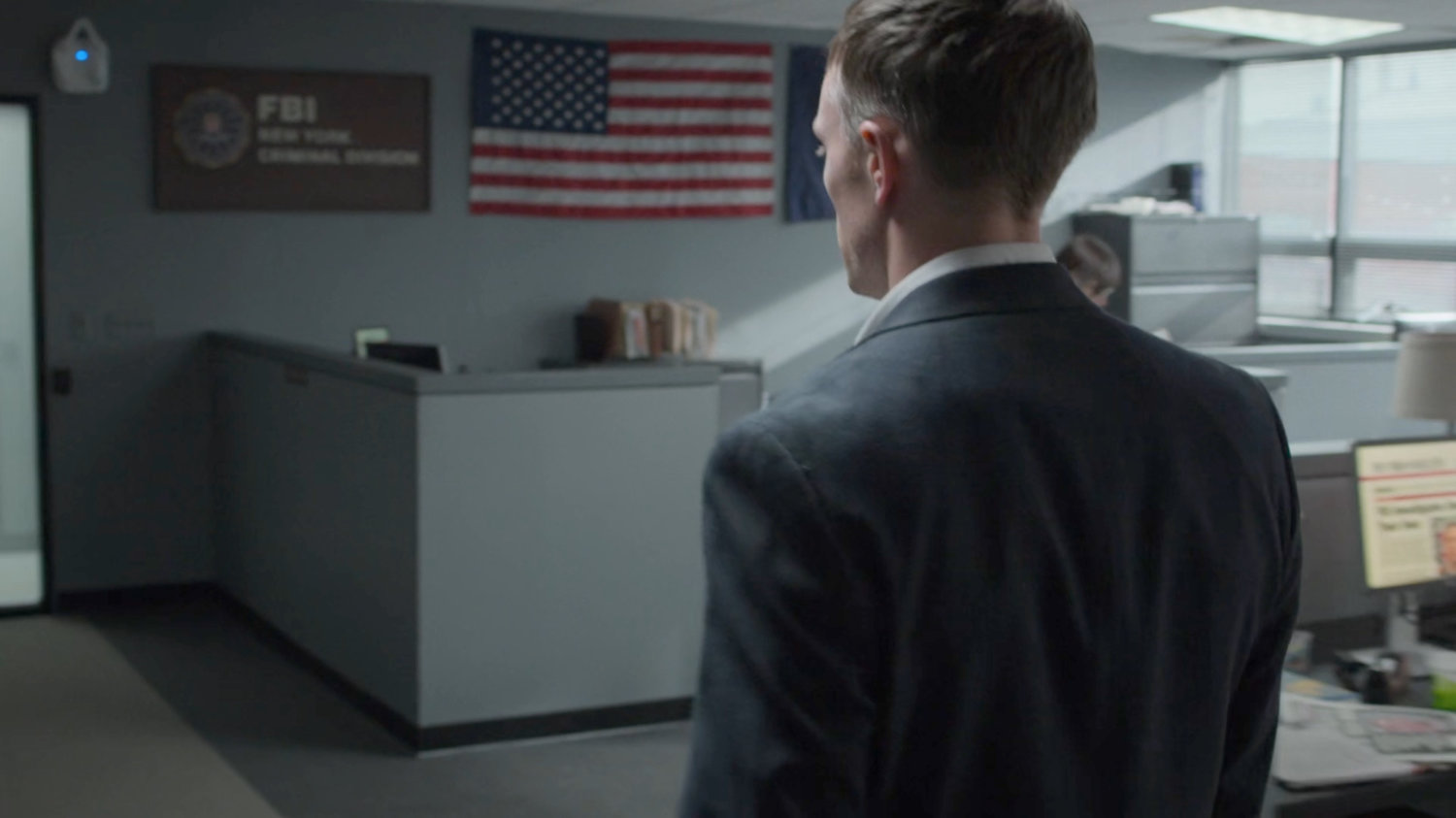 Dex in the offices of the FBI.