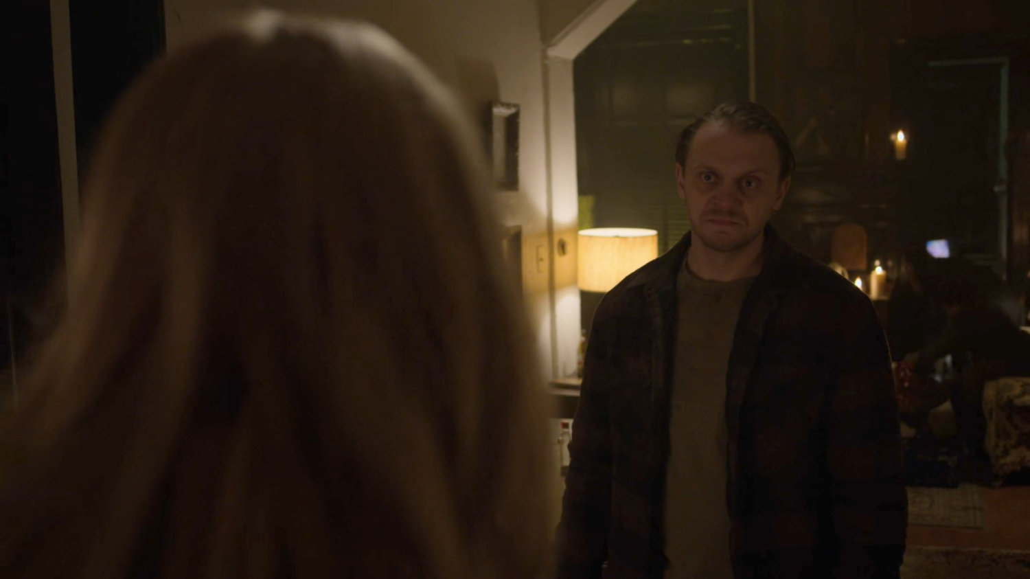 Karen talking to Jasper Evans inside his rowhome.