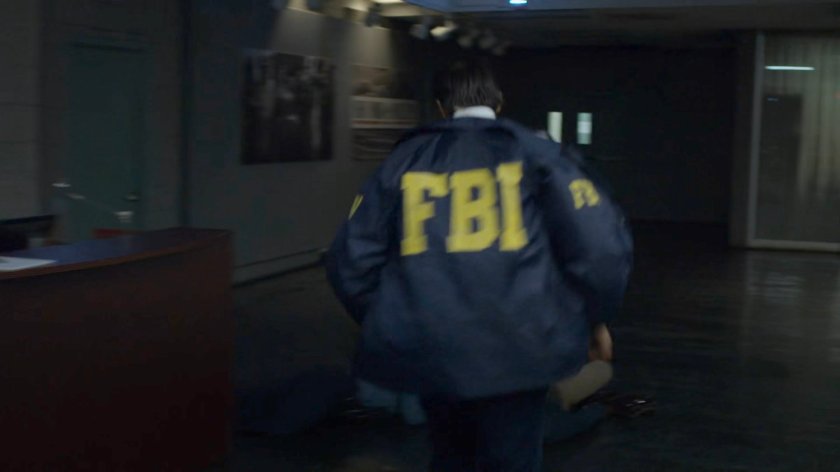 Agent Nadeem runs through the New York Bulletin lobby.