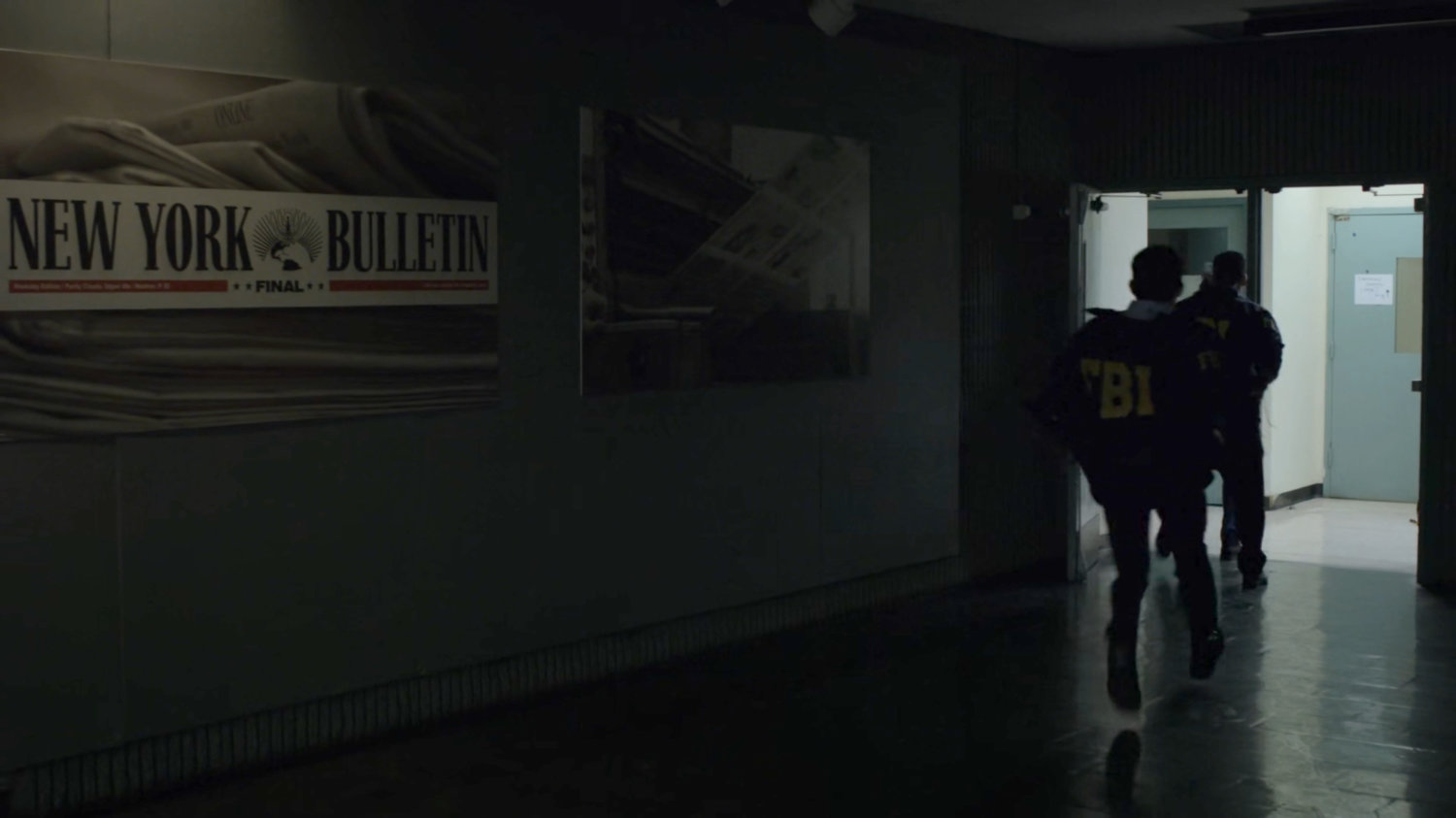 Agent Nadeem runs through the New York Bulletin lobby.