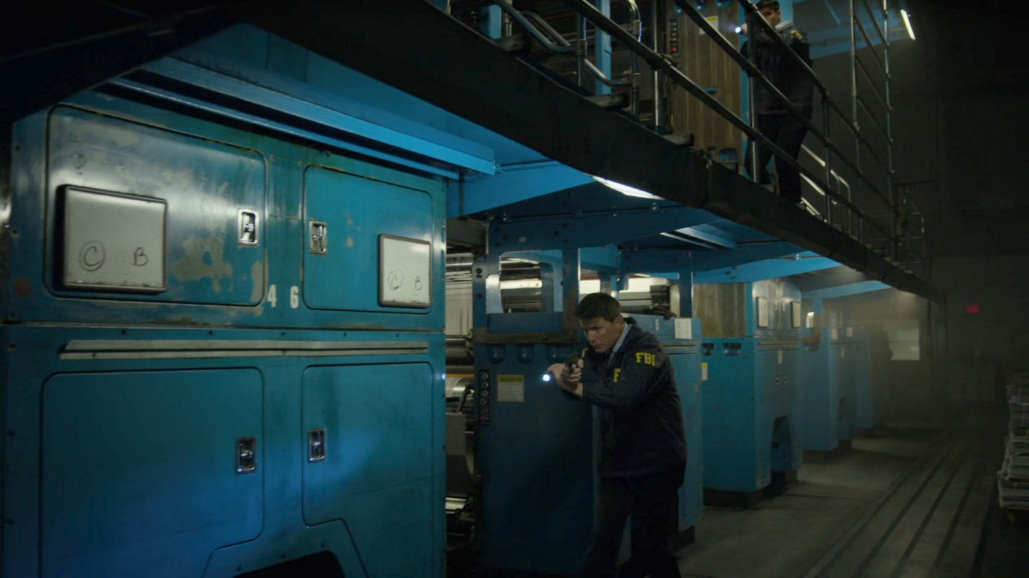 FBI Agents search the printing press area of the New York Bulletin.