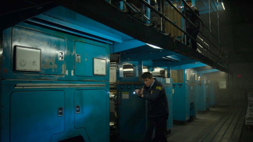 FBI Agents search the printing press area of the New York Bulletin.