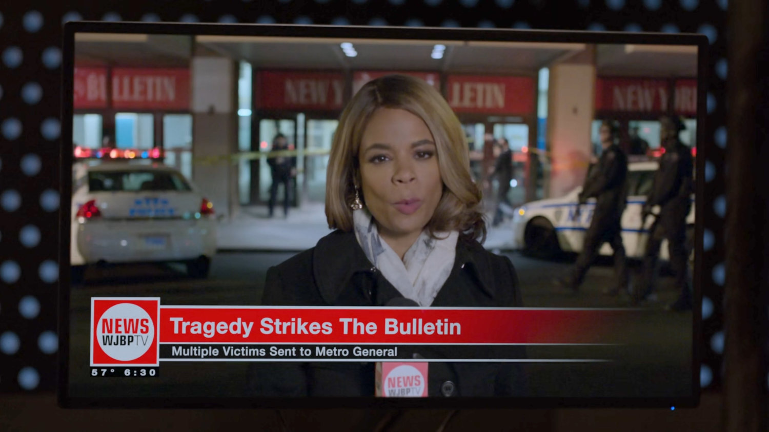 News reporter reporting from in front of the New York Bulletin building.