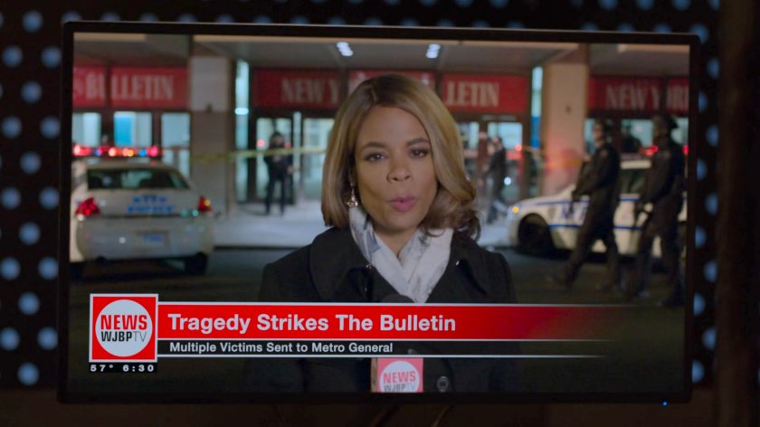 News reporter reporting from in front of the New York Bulletin building.